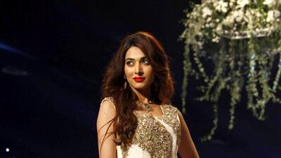 A model presents a creation by designer Rani Emaan. EPA/Rehan Khan / ep