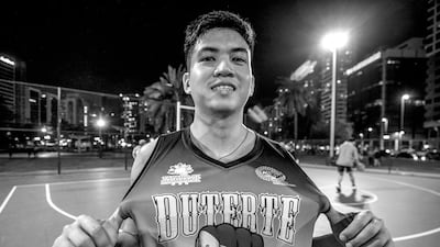 Marco De Castro, a die-hard fan of Philippines President Rodrigo Duterte, proudly shows off his shirt.