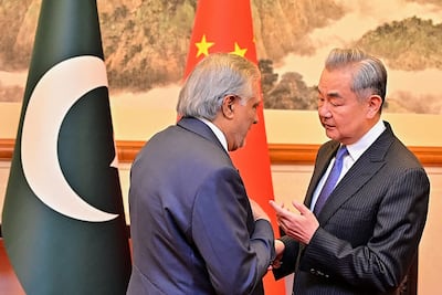 Pakistan's Foreign Minister Ishaq Dar, left, met his Chinese counterpart Wang Yi in Beijing. AFP