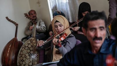 A female Yemeni music student plays the violin during a music class at the Cultural Centre in Sanaa, Yemen.Hani Mohammed / AP Photo