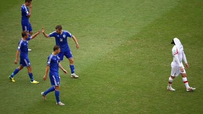 Bosnia players celebrate their team's second goal against Iran on Wednesday at the 2014 World Cup. Michael Steele / Getty Images