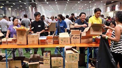 Hundreds of volunteers participated in the Adopt-a-Camp charity. Sammy Dallal / The National