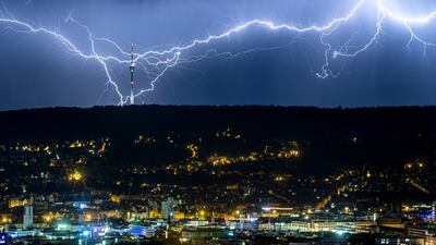 Lightning is seen over the city of Stuttgart, southern Germany, as the heat wave in large parts of Europe gives way to storms and heavy rain. AP