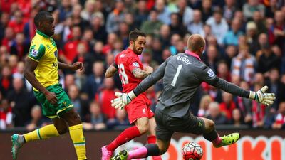 Liverpool striker Danny Ings shoots past goalkeeper John Ruddy to open the scoring against Norwich City. Alex Livesey / Getty Images