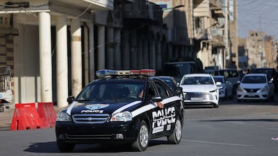 A police vehicle in Baghdad on Sunday. Forty-seven officials were detained in a series of anti-corruption raids in the Iraqi capital. AFP