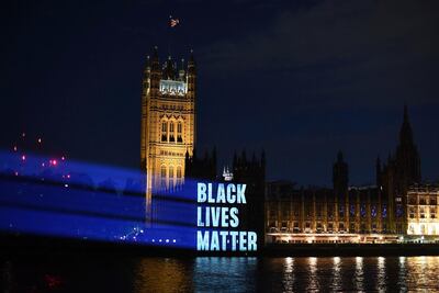 Black Lives Matter is projected onto the Houses of Parliament, in London, as part of the ongoing worldwide demonstrations following the death of George Floyd. AP