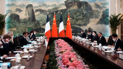 Chinese Premier Li Qiang and French President Emmanuel Macron at a meeting at the Great Hall of the People. AFP