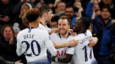 Teammates celebrate with Christian Eriksen, centre, after the substitute scored an 80th-minute winner for Tottenham against Inter Milan. Reuters