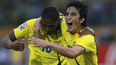 Antonio Valencia, left, celebrates with Ecuador teammate Pablo Palacios during their World Cup qualifying victory against Argentina. The winger has been signed by Manchester United from Wigan Athletic.