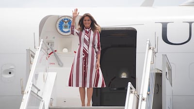 US First Lady Melania Trump waves during an arrival ceremony after landing at Kotoka International Airport in Accra. AFP