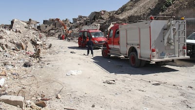 Iraqi civil defence search for bodies under the rubble of buildings in the northern Iraqi city of Mosul on May 16, 2018. Walid Al Khalid / AFP