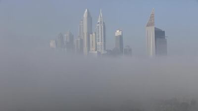 Thick fog blankets Dubai Marina. The fog delayed flights on Monday at Dubai International Airport. Jon Gambrell / AP Photo