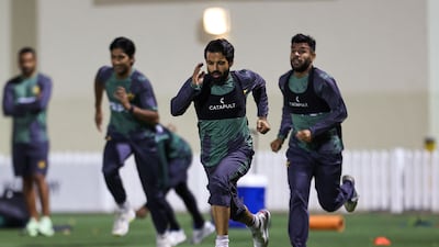 Pakistan players warm up during a practice session in Dubai. AFP