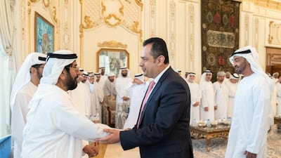 Sheikh Tahnoon bin Mohamed greet Dr Abdulmalik during a Sea Palace barza as Sheikh Mohamed bin Zayed looks on.