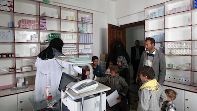 A Yemeni family receives Thalassaemia medication at a pharmacy in Sanaa on March 2, 2016. Mohammed Huwais / AFP Photo