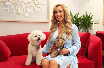 Deborah Alessi says her two dogs, Highland and Bonnie, are her little comfort zones in a new country. Pawan Singh / The National