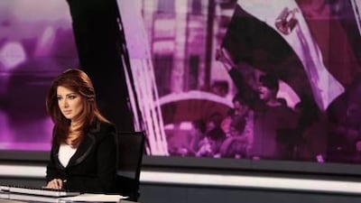News anchor Rola Ibrahim is seen in the studio of the Al Jazeera satellite news channel in Doha.