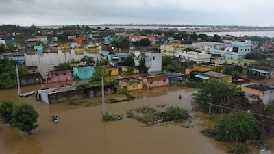 Hundreds of homes were submerged and dozens of cattle were swept away in the gushing, brown murky water. Photo: AP