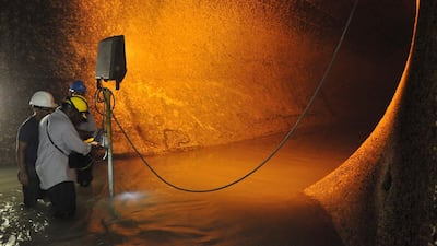 Panama Canal's workers inspect sewers in Miraflores locks western gate during maintenance works. Ed Grimaldo / AFP
