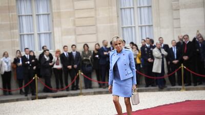 Brigitte, wearing a baby blue Louis Vuitton suit, arrives at the Elysee presidential palace on May 14, 2017, in Paris. AFP