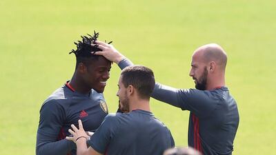 Belgium forward Michy Batshuayi (L) jokes with teammates during a training session during the Euro 2016 football tournament at Le Haillan on June 30, 2016. Nicolas Tucat / AFP