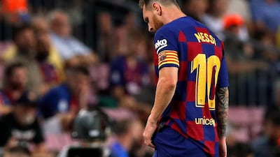 Barcelona's Lionel Messi rwalks off the pitch to receive treatment. Reuters