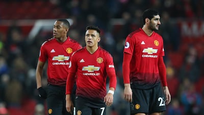 Manchester United players Alexis Sanchez, Anthony Martial and Marouane Fellaini are visibly disappointed after their draw against Crystal Palace on Saturday. Getty Images