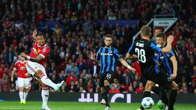 Memphis Depay of Manchester United scores his team's opening goal on Tuesday night to equalise 1-1 against Club Brugge in the Champions League. Alex Livesey / Getty Images
