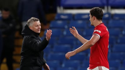 Ole Gunnar Solskjaer celebrates with Harry Maguire after the match. Reuters