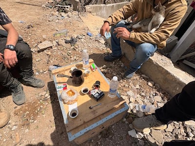 Young men, unwilling to leave their village exposed to advances by Israeli forces, sleep in the few homes left standing in the uninhabitable village of Dibbin. Nada Homsi / The National