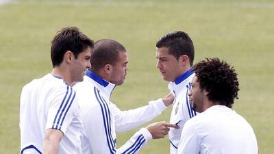 Real Madrid's Cristiano Ronaldo, second right, talks with his compatriot Pepe, second left. EPA