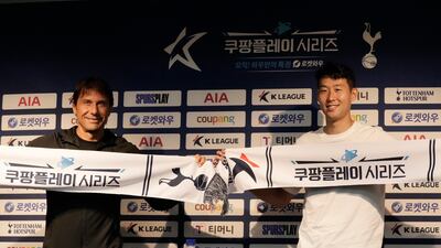 Tottenham's head coach Antonio Conte, left, and Son Heung-min pose for photos. AP Photo