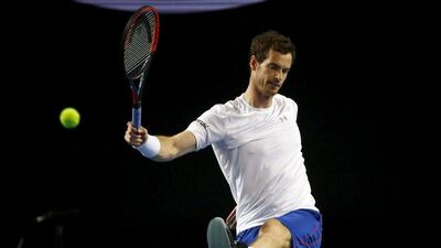 Andy Murray kicks a tennis ball during a practice session at Melbourne Park on Thursday ahead of the Australian Open. David Gray / Reuters