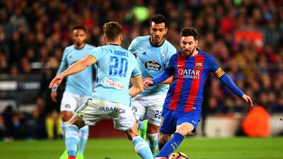 Lionel Messi of Barcelona runs past Sergi Gomez of Celta Vigo to score the opening goal at the Camp Nou on March 4, 2017 in Barcelona, Spain. Dan Istitene / Getty Images