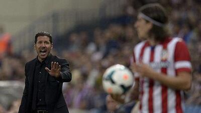 Diego Simeone, left, guided his Atletico Madrid side to a win over Elche late on Friday night. Dani Pozo / AFP