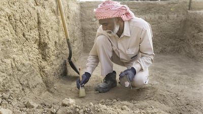 Abdal Azeez, a worker for the Abu Dhabi Tourism & Culture Authority, TCA, excavating the site which is believed to date from the late 17th century. Christopher Pike / The National