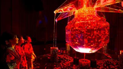 Guest attendees wearing kimonos look at goldfish swimming in a tank at the “Art Aquarium 2016” exhibition at the Nihonbashi Mitsui Hall in Tokyo, Japan. At the exhibition housing about 8,000 goldfish, the aquarium artist Hidetomo Kimura created a space where the visitors can time-travel to the Edo period of Tokyo, where the culture of admiring goldfish was born. Tomohiro Ohsumi / Getty Images