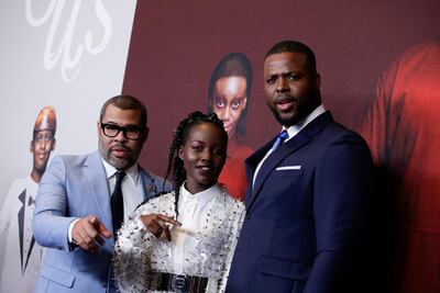Director Jordan Peele, (L) and actors Lupita Nyong'o (C) and Winston Duke attend the 'Us' premiere at The Museum of Modern Art in New York City. REUTERS/Eduardo Munoz