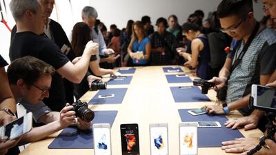 The new phones are roughly the same size and will cost the same as the record-selling 6 and 6 Plus models introduced last year, which will now sell for $100 less. Monica Davey / EPA