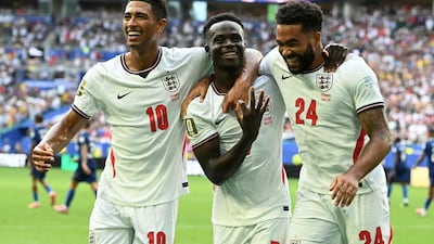 England forward Bukayo Saka, centre, celebrates after scoring his team's fifth goal. AFP