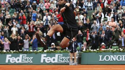 France’s Jo-Wilfried Tsonga jumped, danced and waved a towel after defeating Tomas Berdych in four sets 6-3, 6-2, 6-7, 6-3 at Roland Garros. David Vincent / AP Photo
