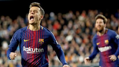 Barcelona's Philippe Coutinho celebrates his first goal for the club in their 2-0 win over Valencia to reach the Copa del Rey final. Juan Carlos Cardenas / EPA