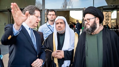 The CEO of the American Jewish Committee, David Harris, left; the Secretary General of the Muslim World League Mohammad Abdulkarim Al Issa; and a member of the Muslim delegation visit the POLIN Museum of the History of Polish Jews on in Warsaw. AFP
