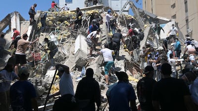 Residents dig through debris in Cali in Colombia, which was rocked by a powerful quake alongside some neighbouring countries. AFP