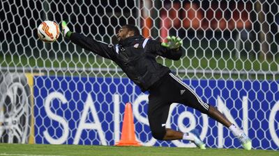 Goalkeeper Khalid Essa at full stretch at training.