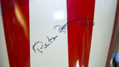 The autographed gas tank of the Captain America chopper Peter Fonda rode in Easy Rider at the Profiles in History auction house. The bike features a forward-angled front wheel and handlebars, fishtail exhaust pipes and a teardrop-shaped gas tank where the protagonists stashed their cash.