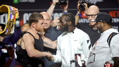 Canelo Alvarez and Terence Crawford shake hands ahead of their face-off. AFP