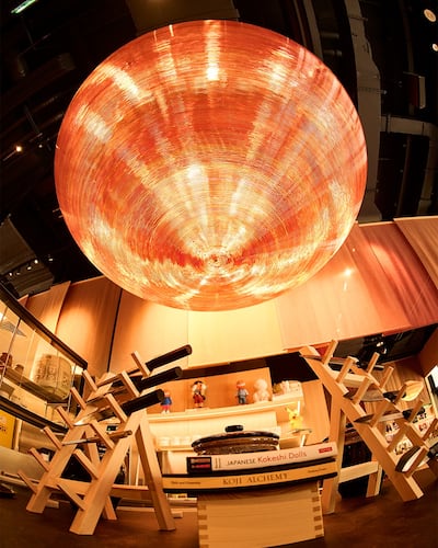 The orange-red disco ball at the centre of the bar at Yubi. Photo: Yubi