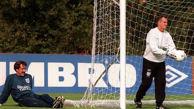 File photo dated 06-10-1997. England goalkeeper David Seaman, right, relaxes as coach Ray Clemence returns to the net during training at Bisham Abbey. PA Photo