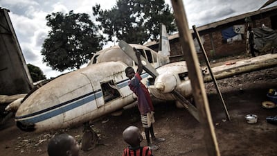 Children play with the wreckage of a plane at the Mpoko Internally Displaced People (IDP) camp in Bangui, Central African Republic. Gianluigi Guercia / AFP Photo